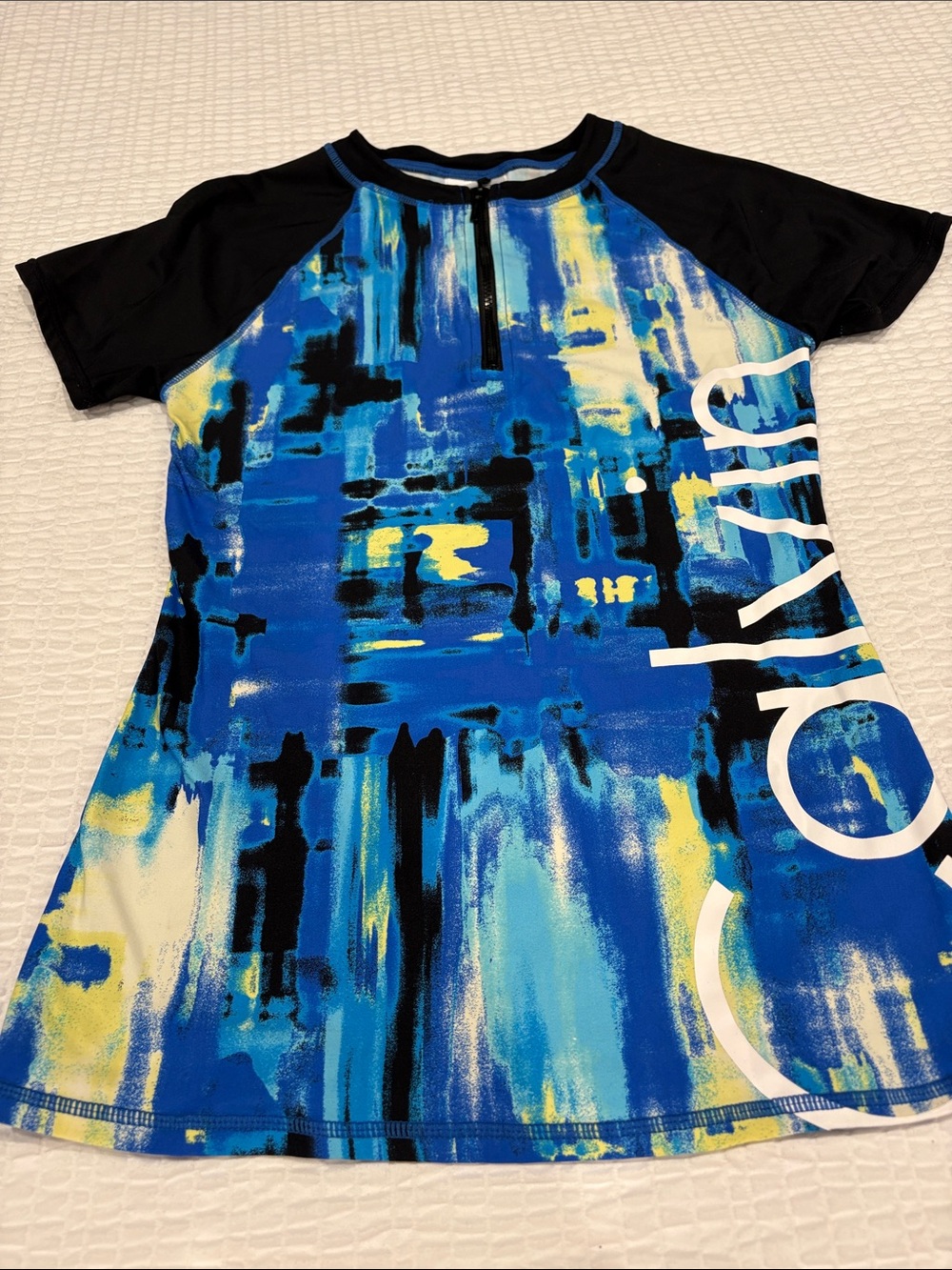 Calvin Klein Blue, Black & Yellow Abstract Woman’s Rashguard
Size M